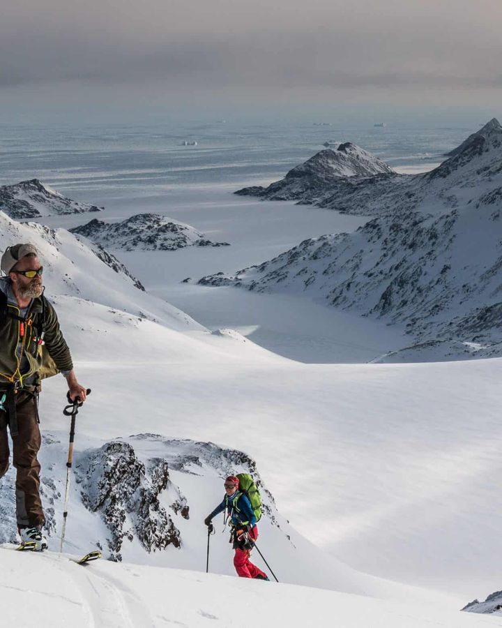 Skinning up a mountain on skis