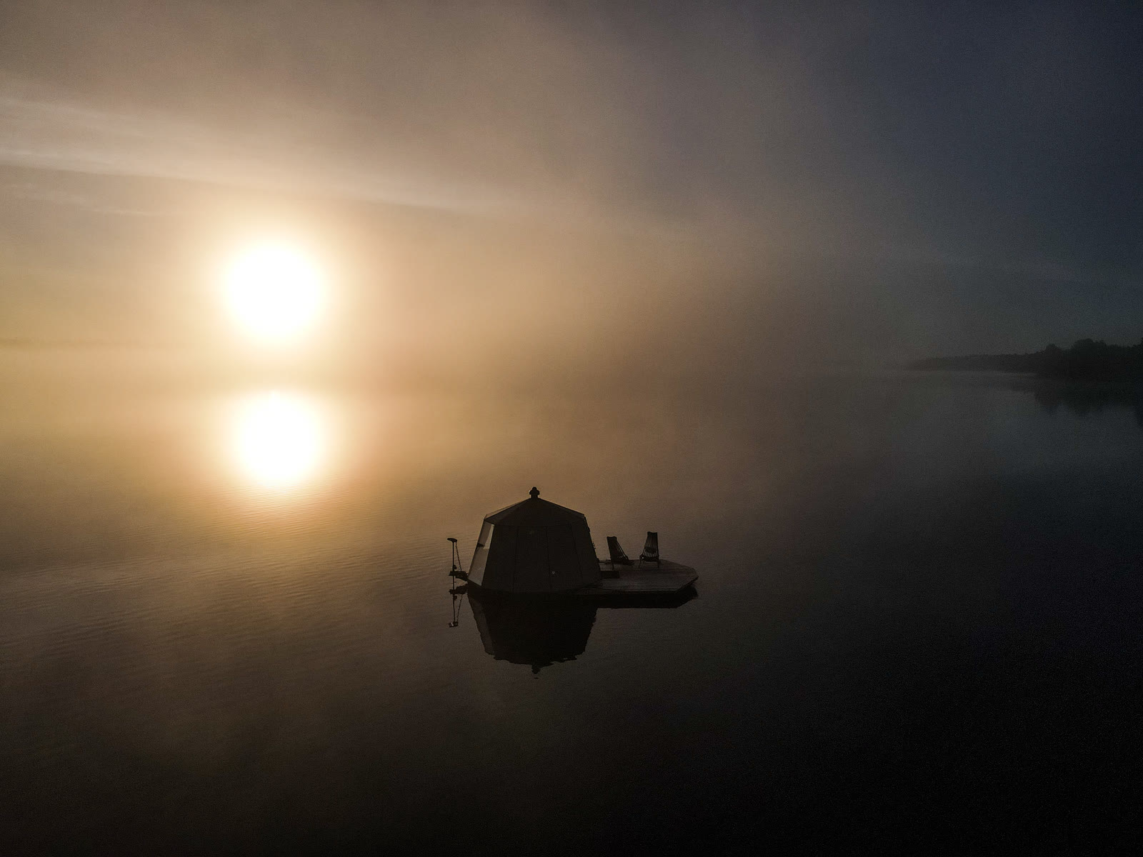 Floating glacier hut at midnight sun